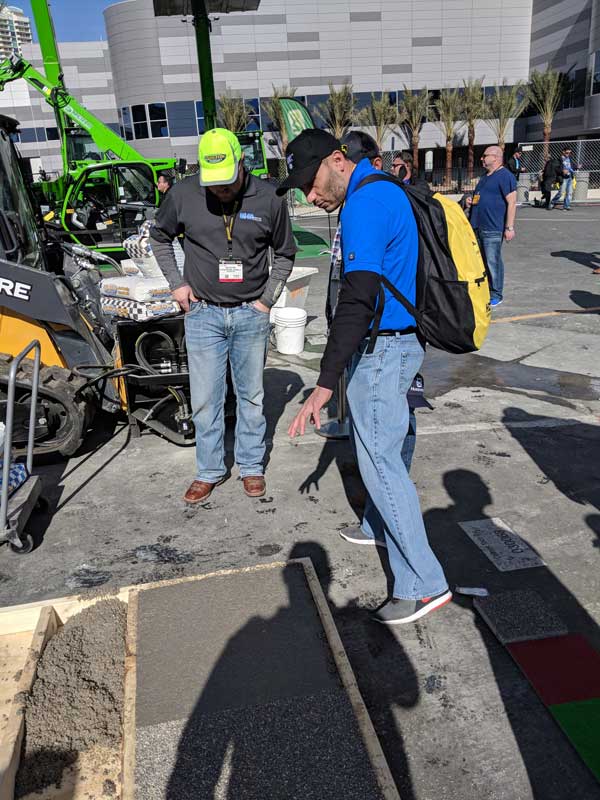 Two person looking at ground